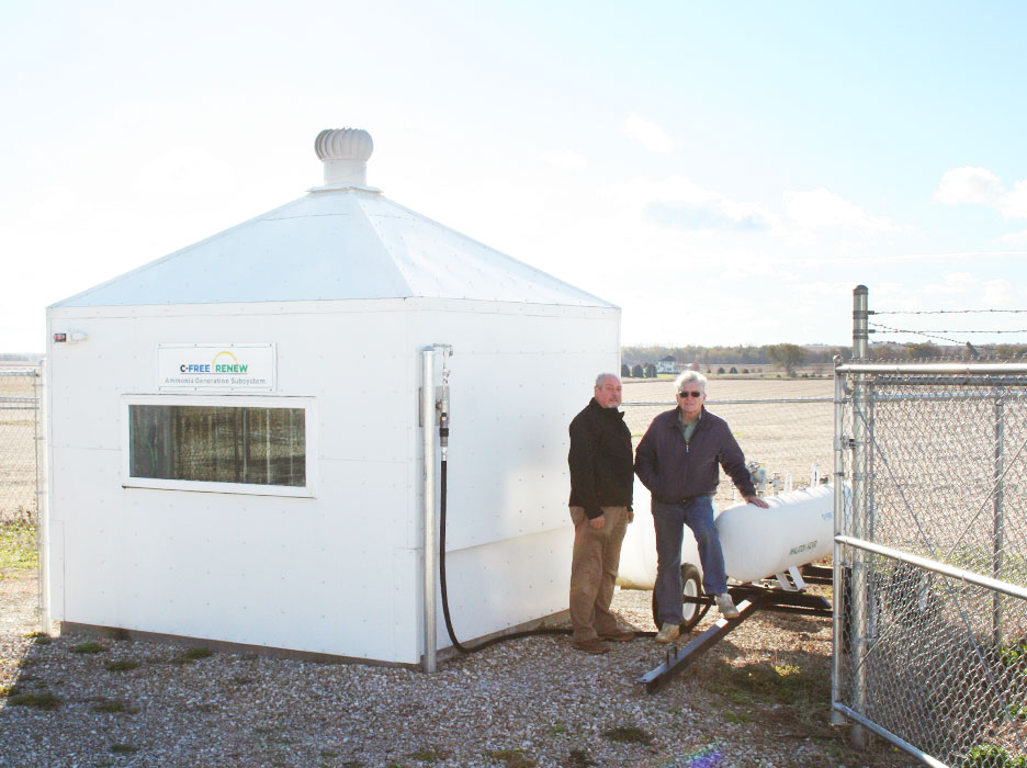 The 10 foot x 10 foot ammonia shed contains the ammonia generation subsystem. David Toyne and Jay Schmuecker are by the mini ammonia nurse tank.
